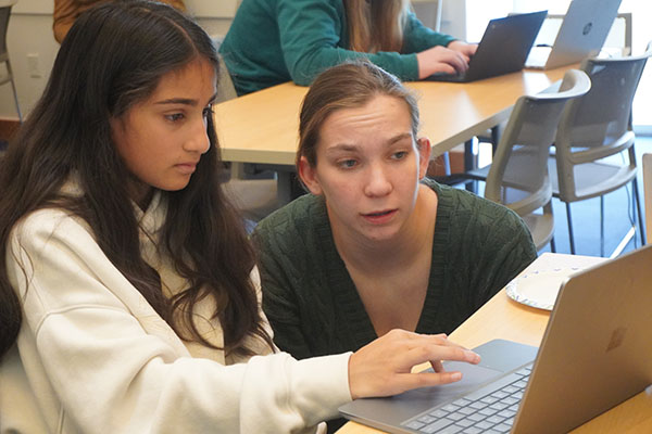 MIT student helping Technovation student