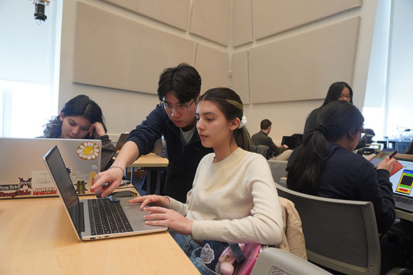MIT student Jacky helping Technovation student