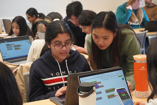 MIT student Jessica helping Technovation student