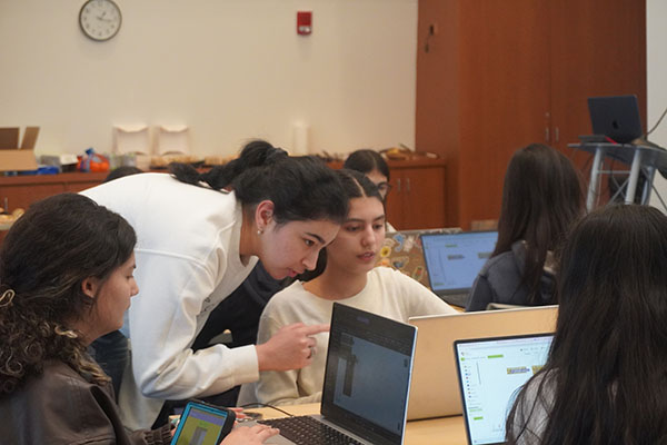 MIT student Jennet helping Technovation student