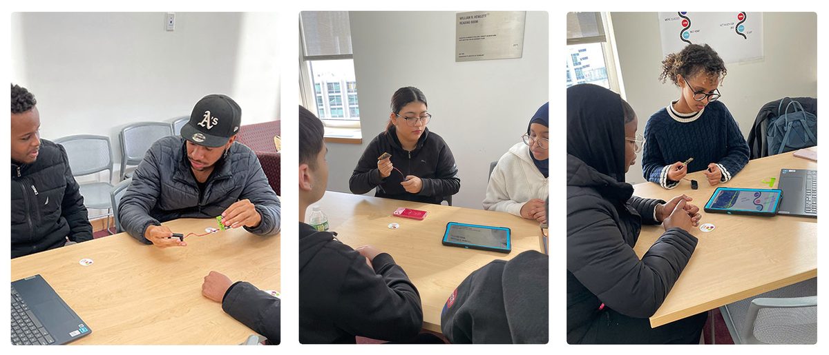 Students at classroom tables testing Micro:bit sensors with tablets.